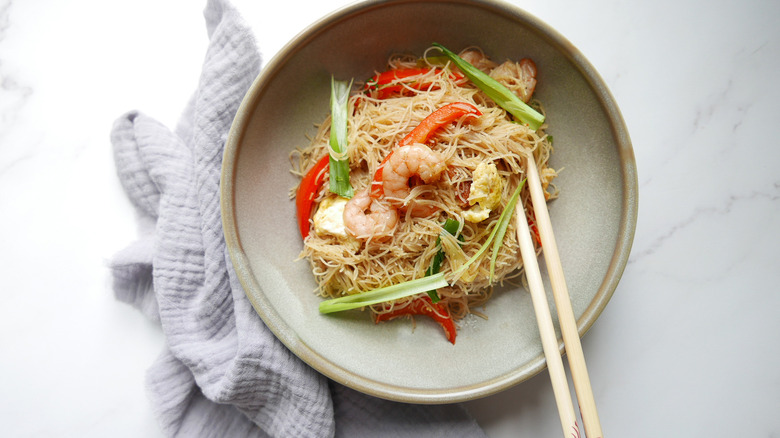 Dish of pan fried vermicelli with chopsticks