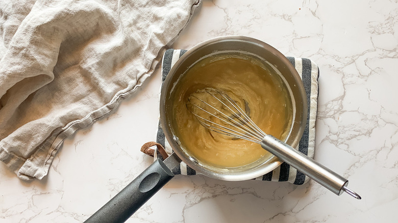 flour and milk in pot