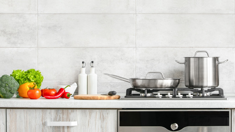 vegetables on counter with pot and pan