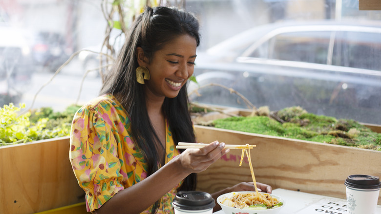 Sarah Thomas enjoying noodles