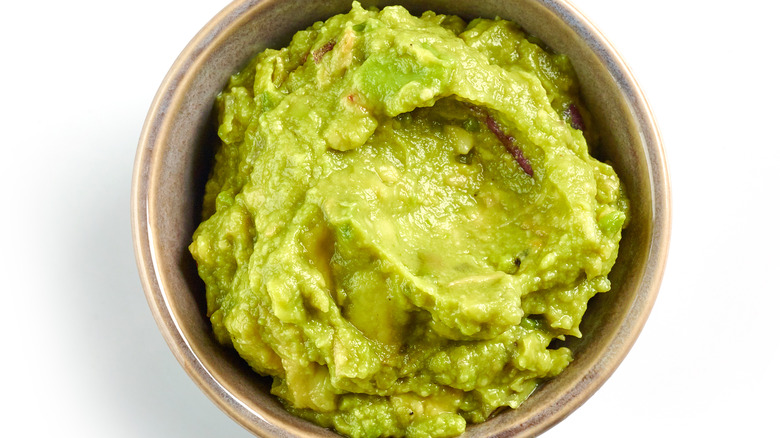 Mashed avocado on a small bowl 