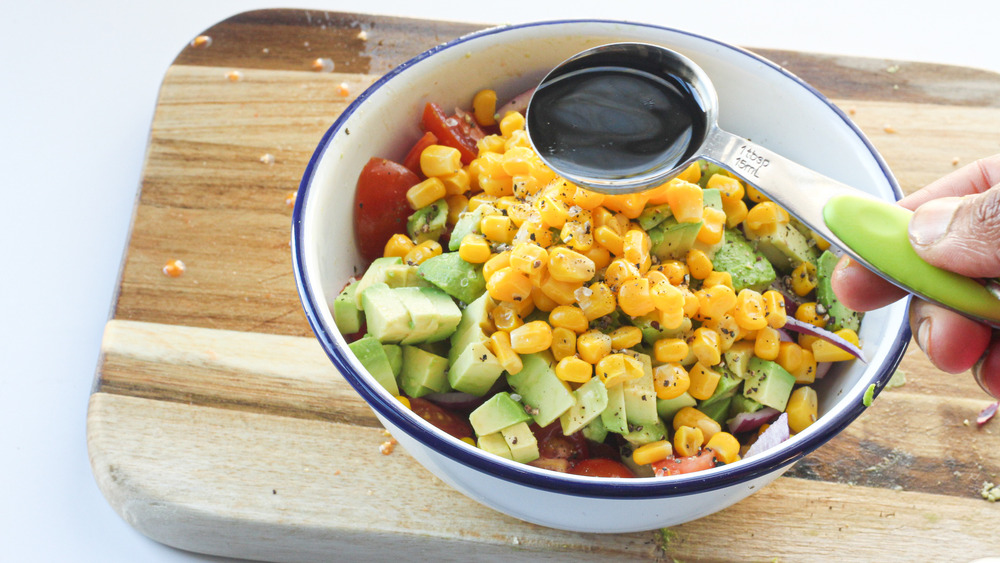 tomato avocado salad in bowl