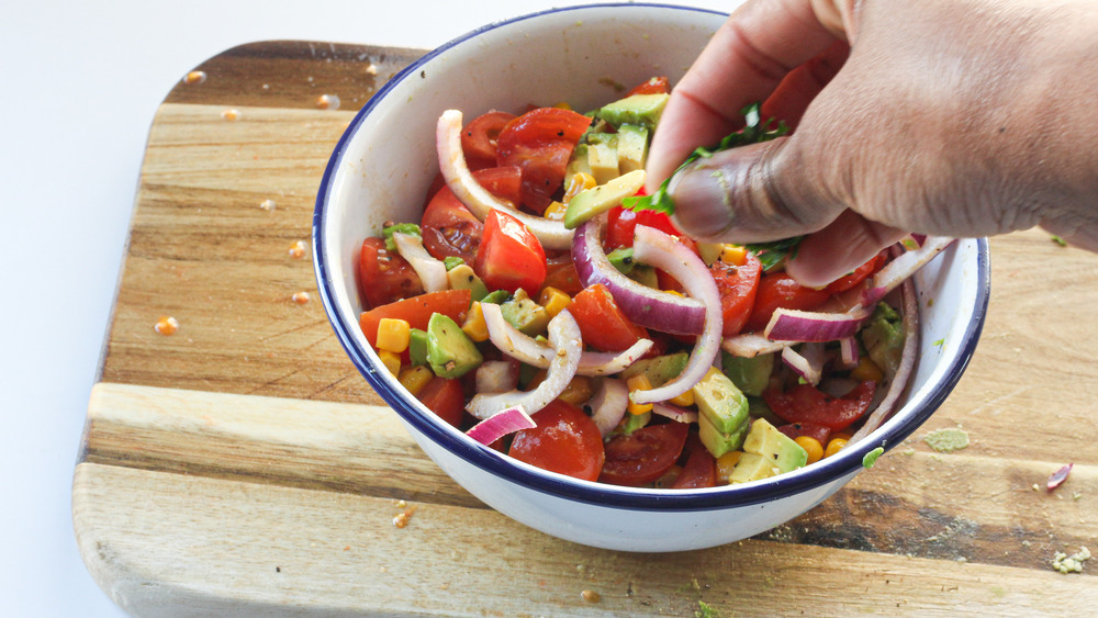 Adding parsley to salad