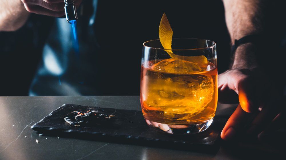 bartender with an Old-Fashioned cocktail