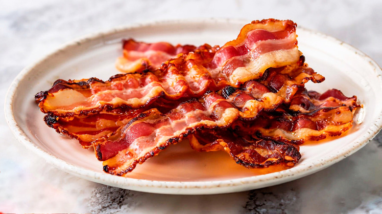 Strips of bacon on plate