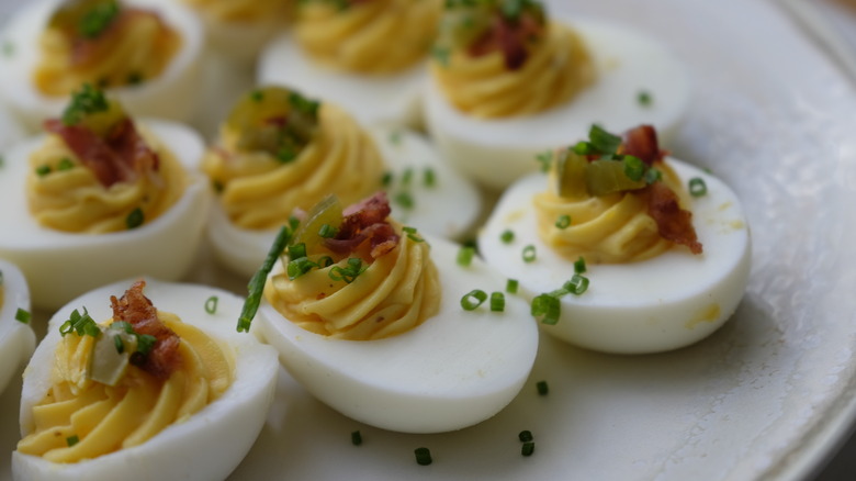 Deviled eggs sitting on a plate