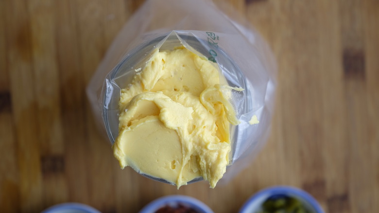 Egg yolk mixture sitting in a piping bag