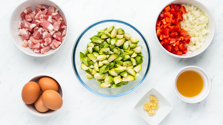 Brussels sprouts hash ingredients in bowls