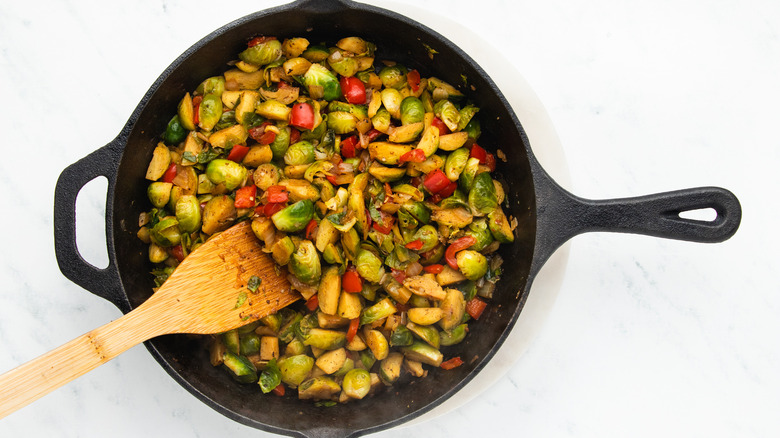 Brussels sprouts hash frying in skillet