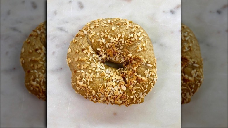 Onion bagel on table