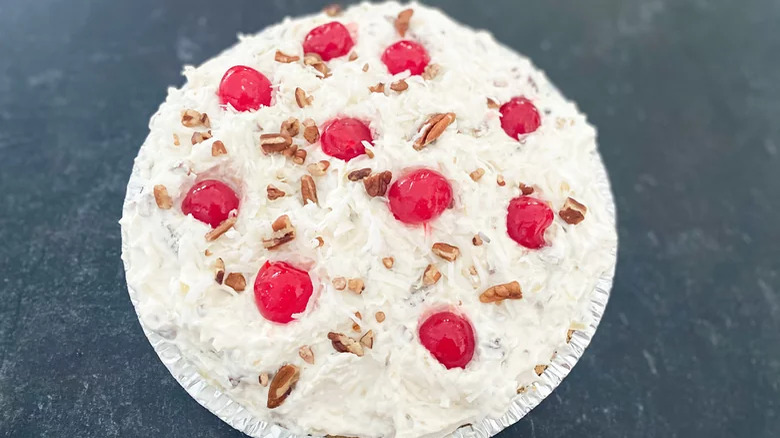 Cream pie with nuts and maschino cherries