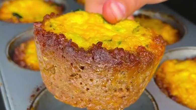 sausage egg muffin with thumb