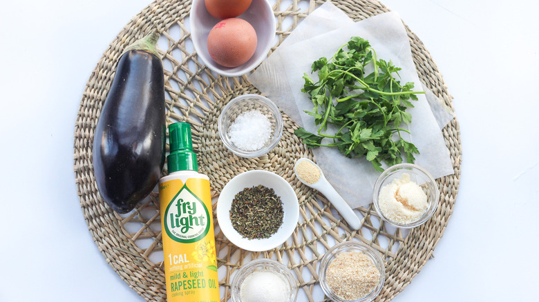 Different kinds of ingredients placed on a round wicker place mat.