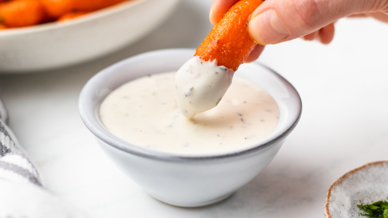 Buffalo baby carrot dipped into ranch dressing