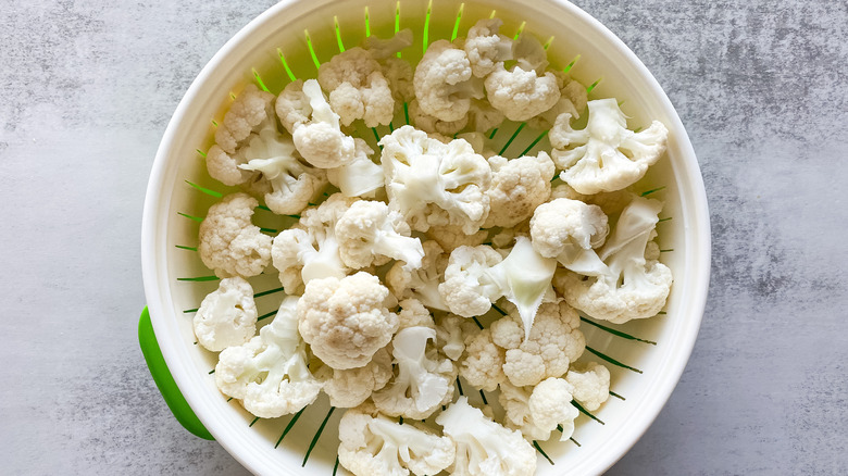 cauliflower florets in strainer