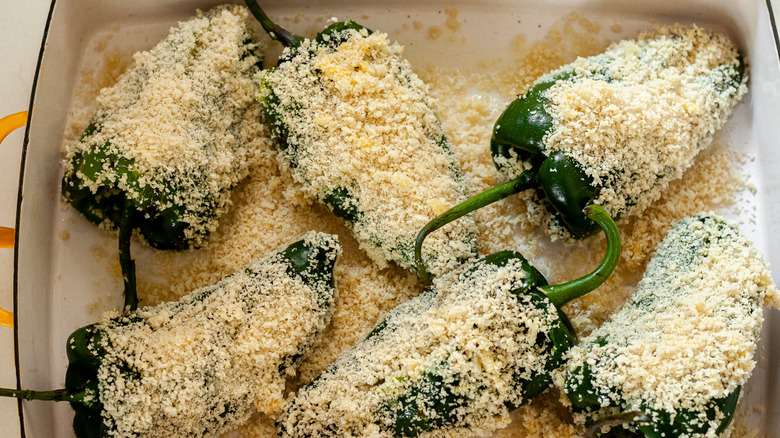 breaded chiles in baking dish