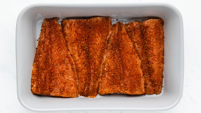 Spicy tilapia fillets in baking dish