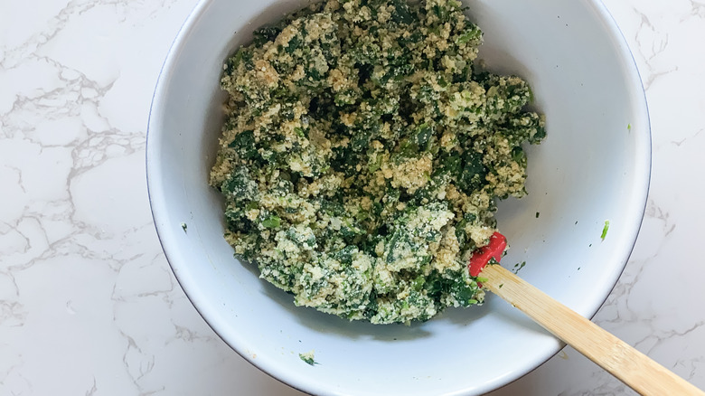 Parmesan spinach ball ingredients combined in bowl