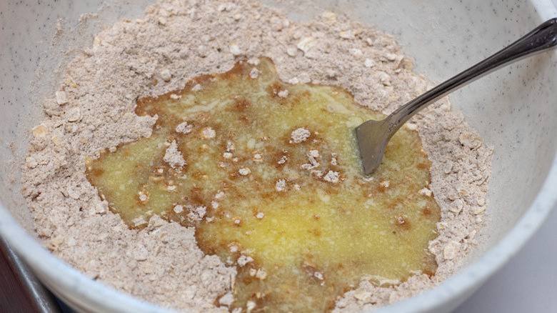 mixing butter with dry ingredients