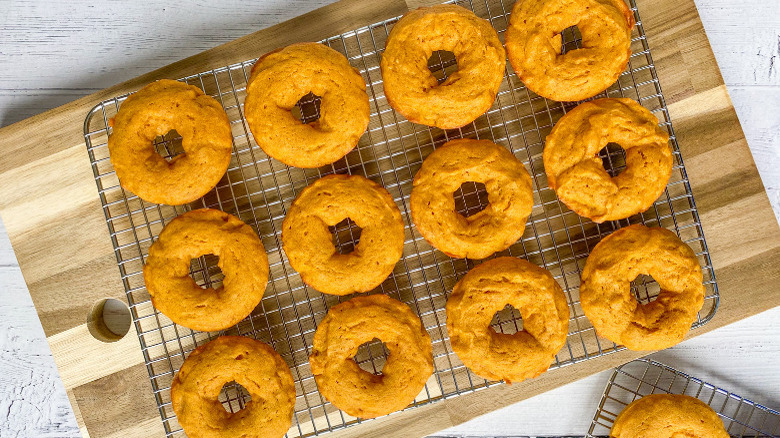 pumpkin donuts on baking rack