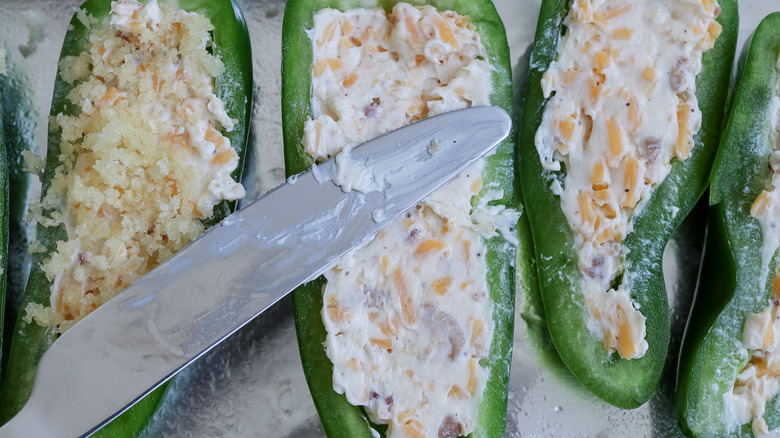 filling jalapeños with cream cheese