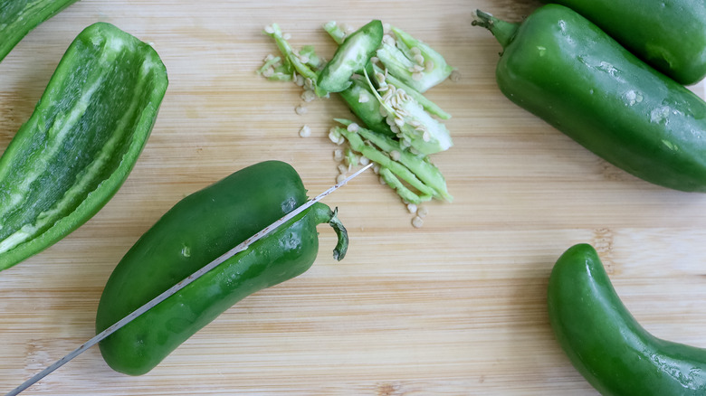 prepping jalapeños with knife