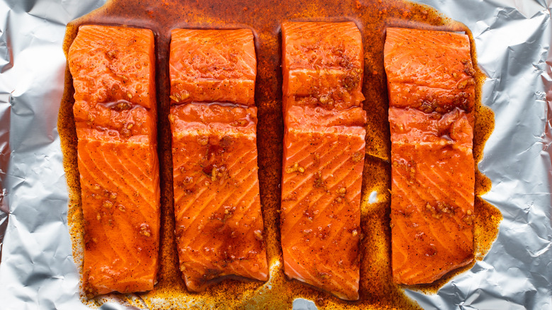 fish with sauce on baking tray