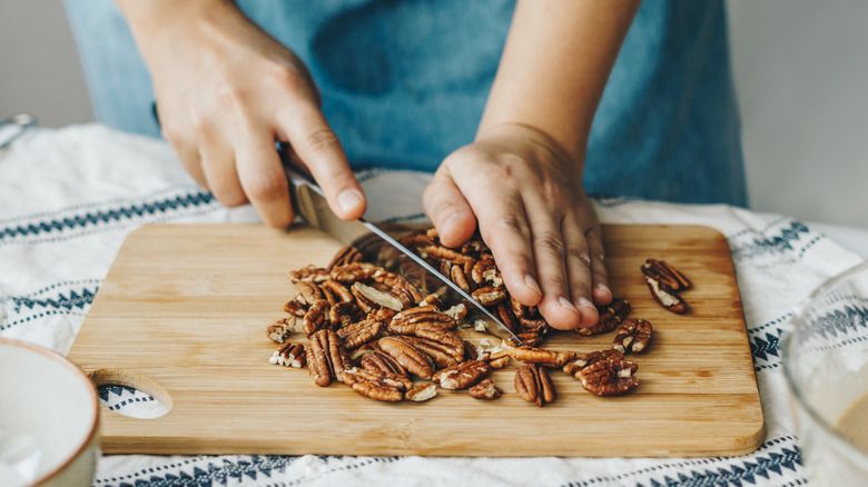 hands chopping nuts