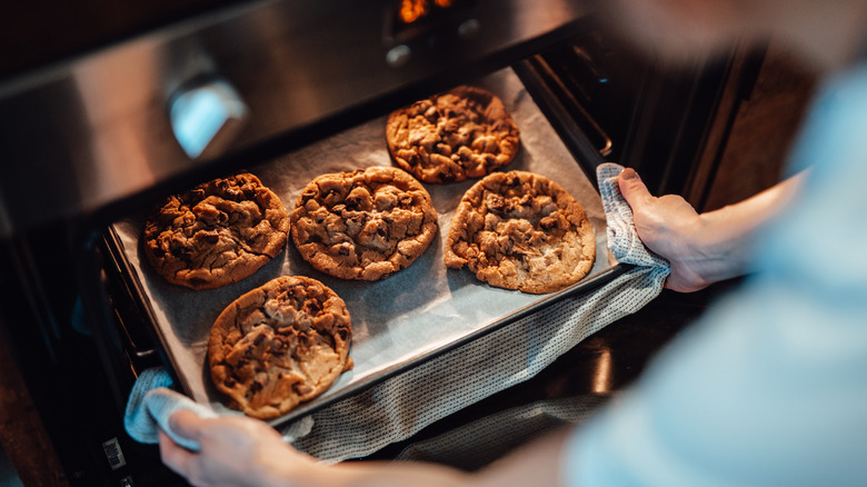 removing baked cookies from oven