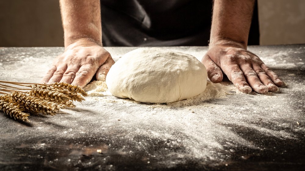 Kneading bread on floured board