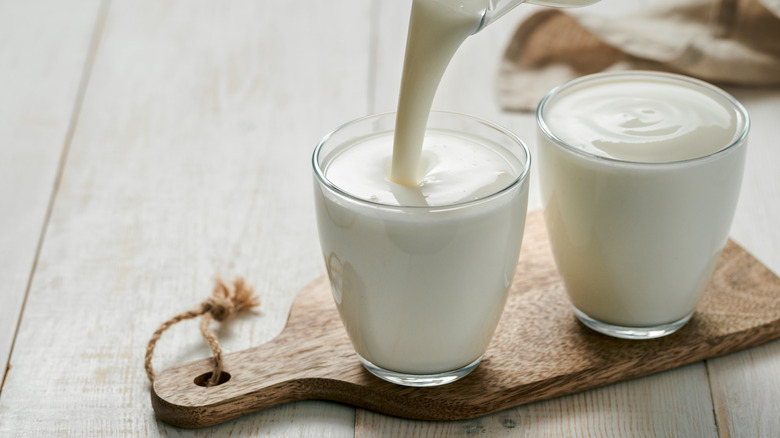 Pouring buttermilk into glass