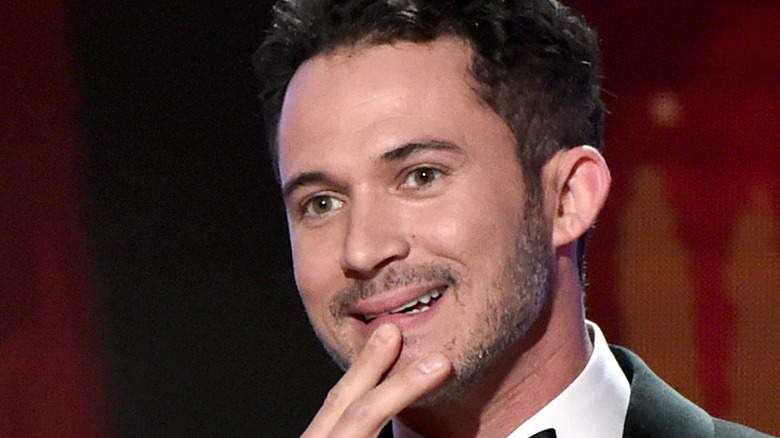 Justin Willman pressing fingers on chin