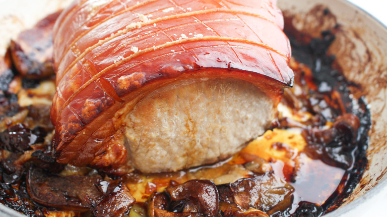 pork loin cooking in pan