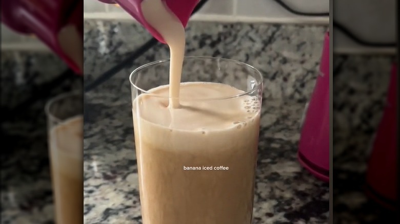 Banana coffee pouring into a glass 