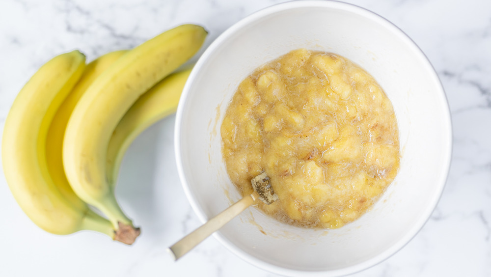 mashing bananas for banana muffins