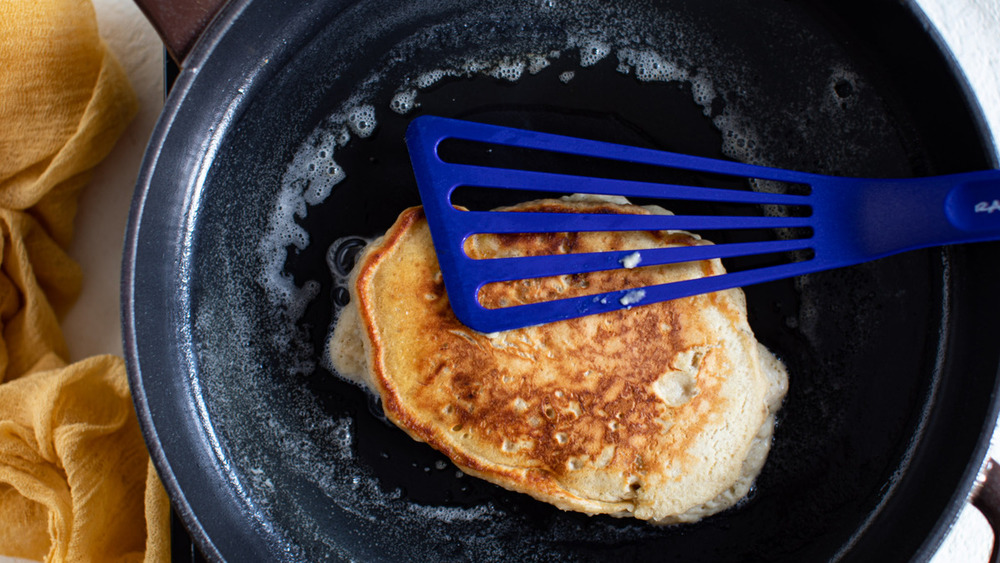 cooking banana pancakes on the griddle