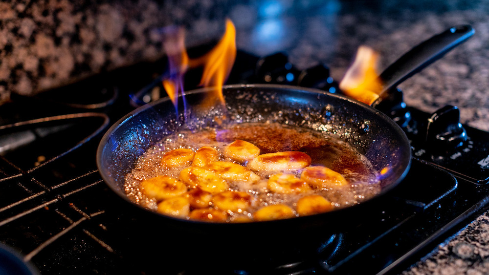 Bananas foster flambe in pan