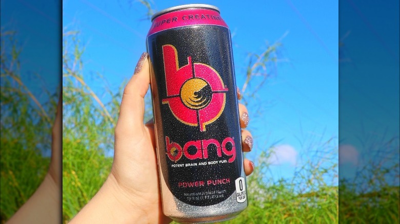 Someone holding can of Bang Energy Power Punch outdoors