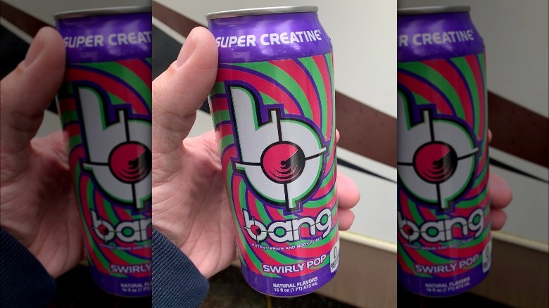 Someone holding a can of Bang Energy Swirly Pop