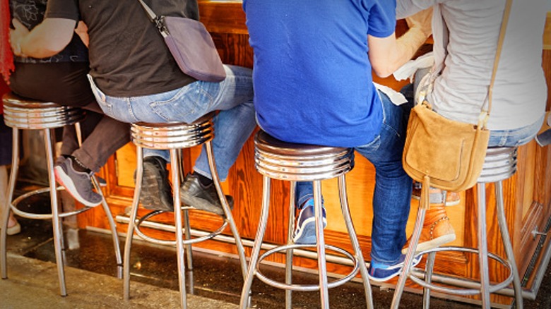 bar patrons on stools