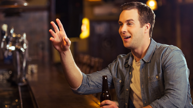 man ordering at bar