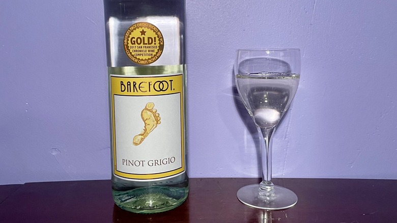 Bottle of white wine and glass