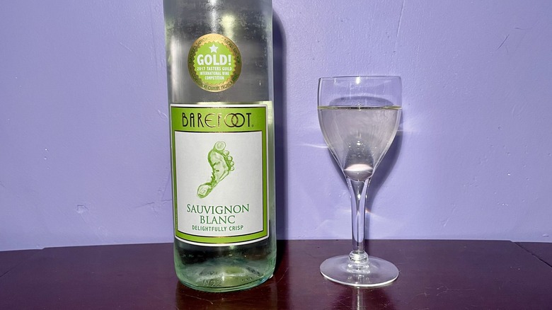 White wine glass and bottle