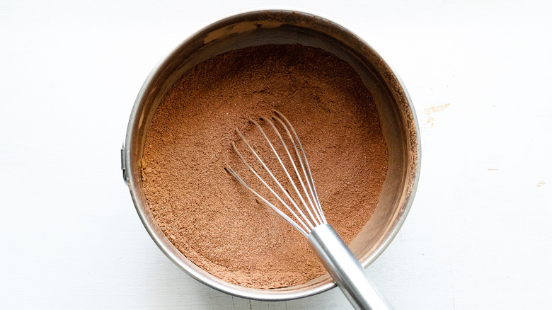 whisking cocoa powder