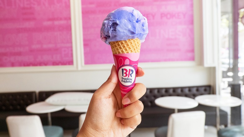 person holding Baskin-Robbins ice cream cone