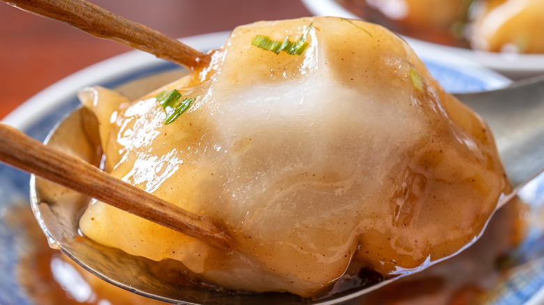 chopsticks holding steamed Taiwanese meatball