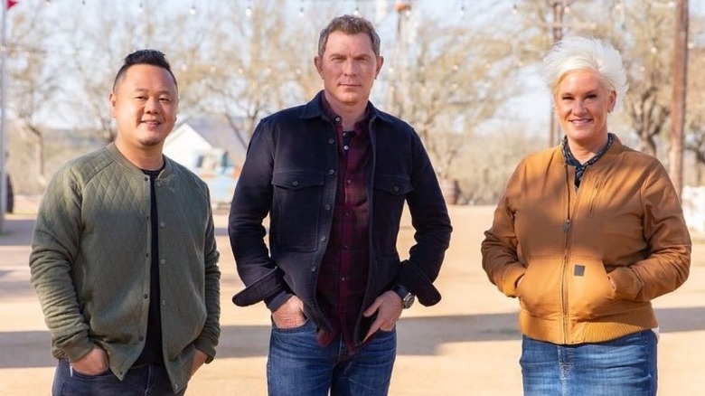 Jet Tila, Bobby Flay, and Anne Burrell standing outside