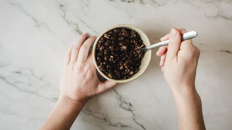 mixing beans with spices