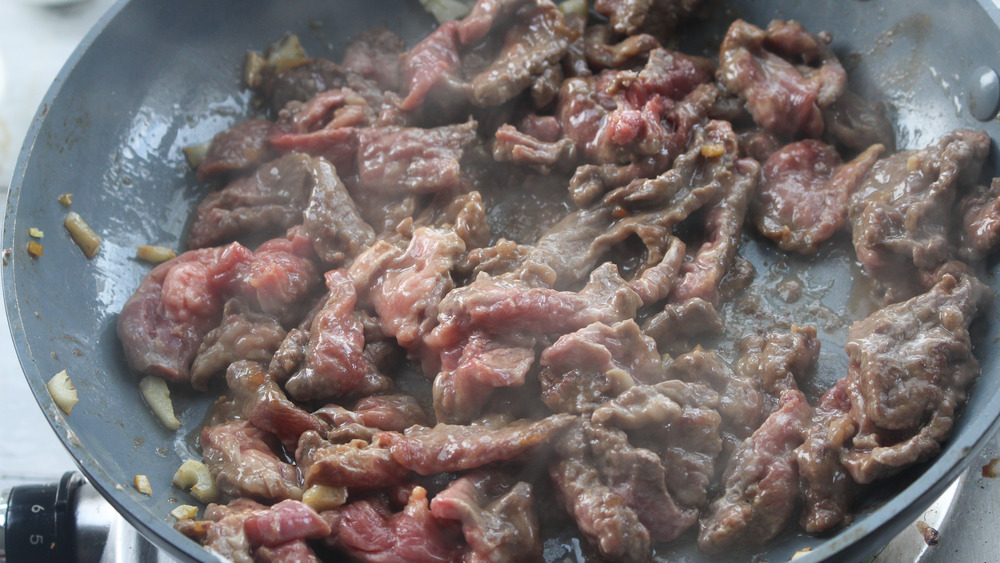 cooking meat for beef and broccoli