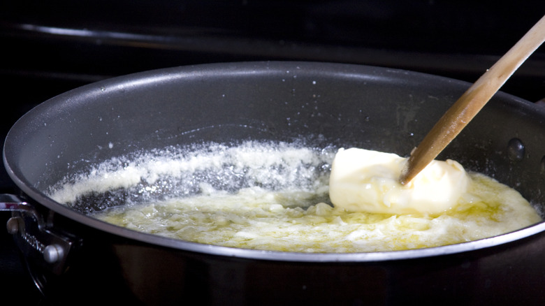 stovetop saucepan of melted butter 